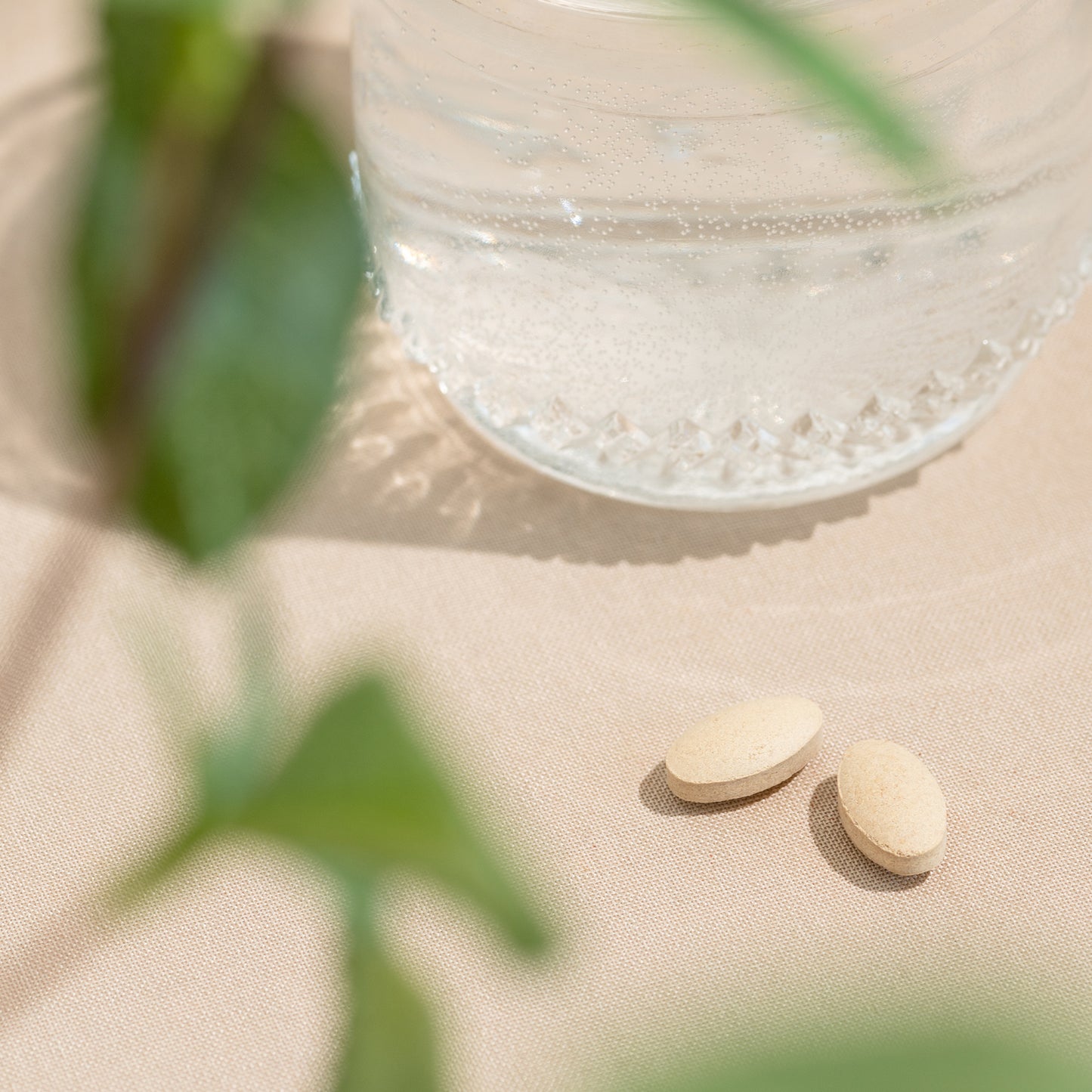 Ashwagandha Tablets next to water glass