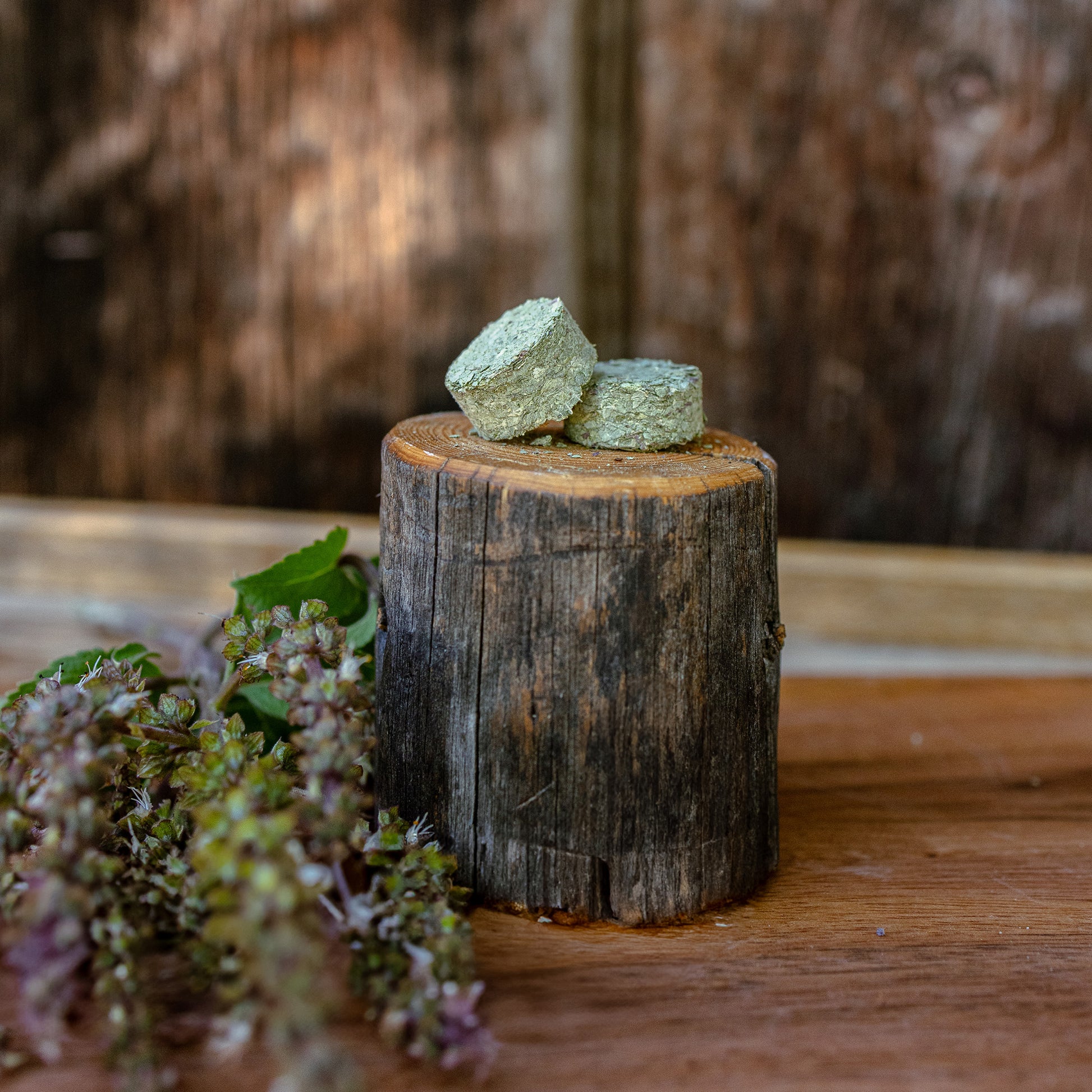 clarifying tulsi tablets on a wooden block with a natural background