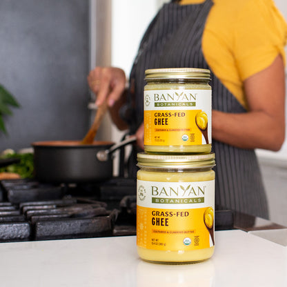 Small and large ghee jars on countertop