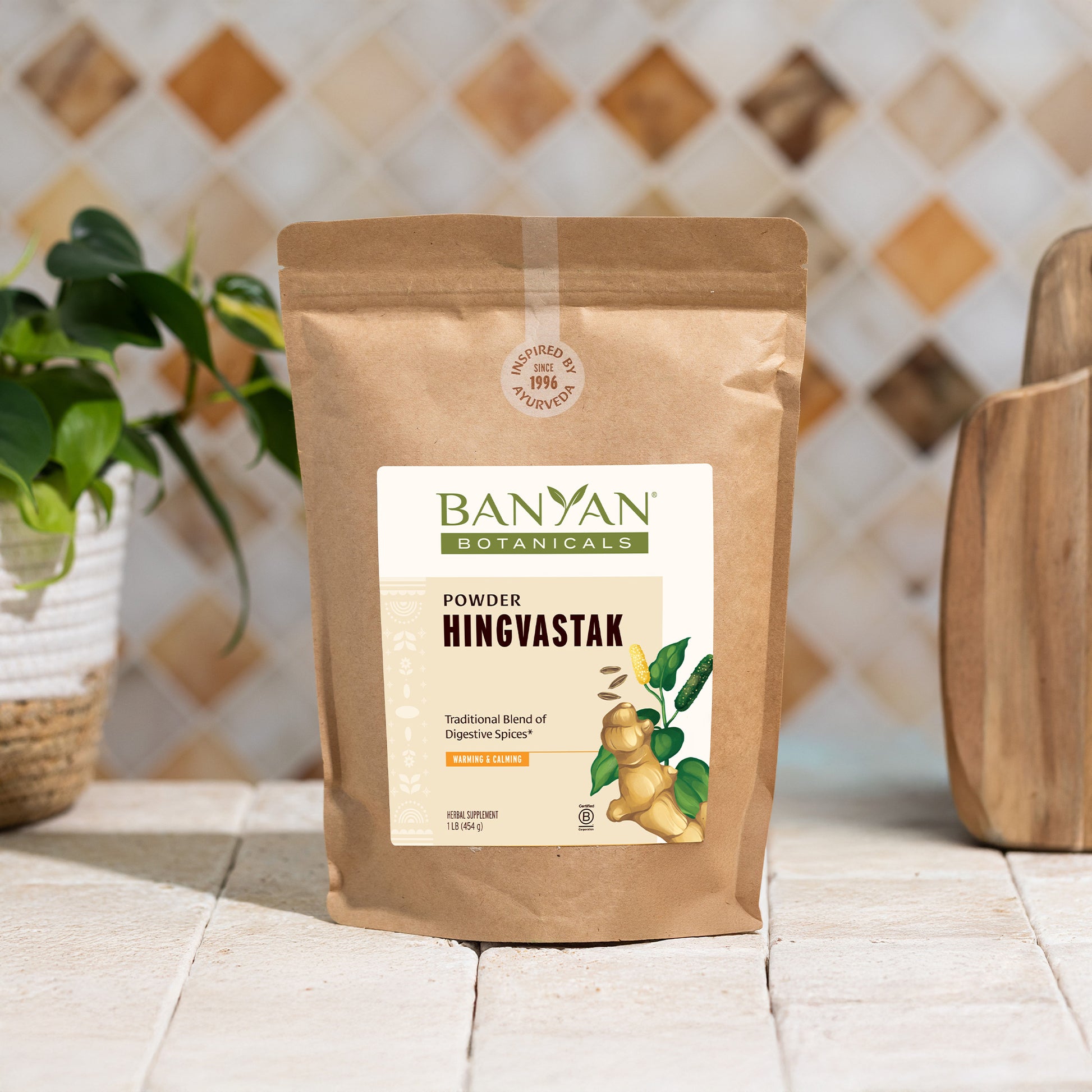 1 lb: Hingvastak pouch sitting on counter next to bowl of dal 