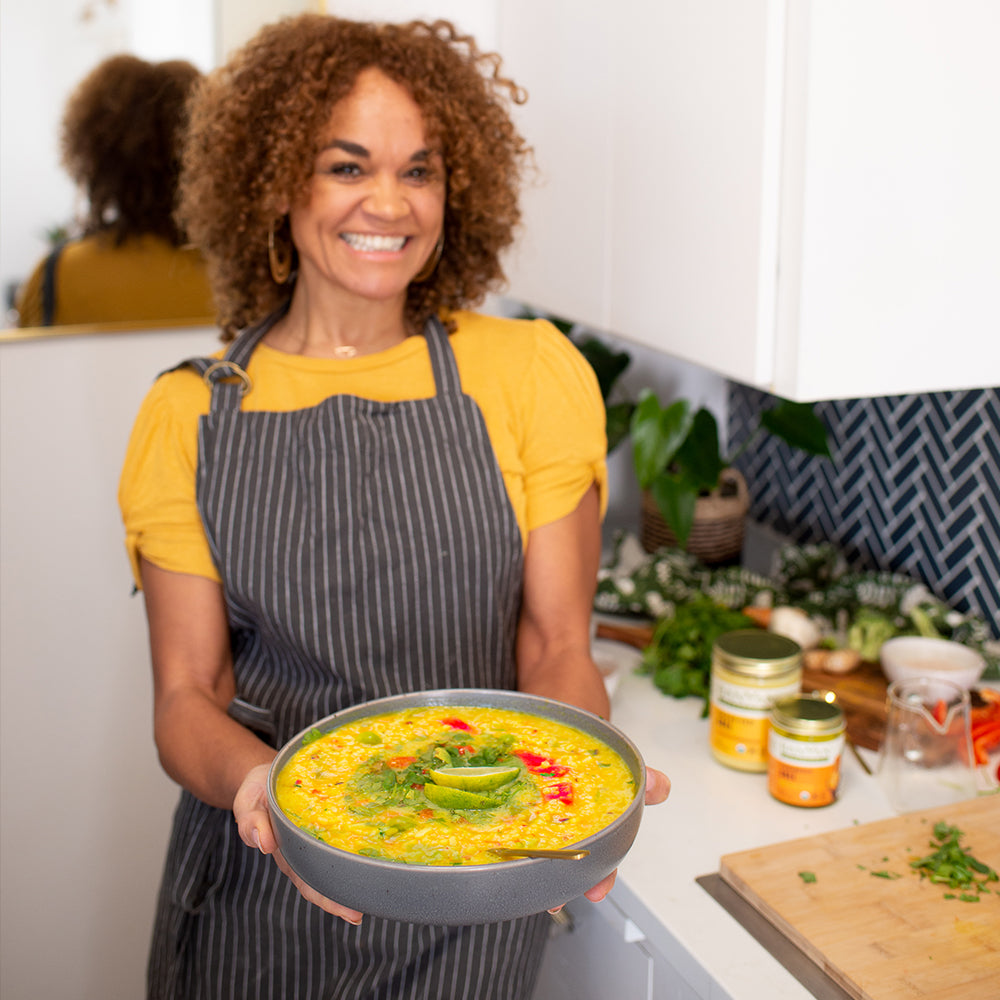 Kitchari Spice Mix being held by woman