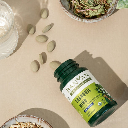 Tranquil Mind™ tablets coming out of bottle