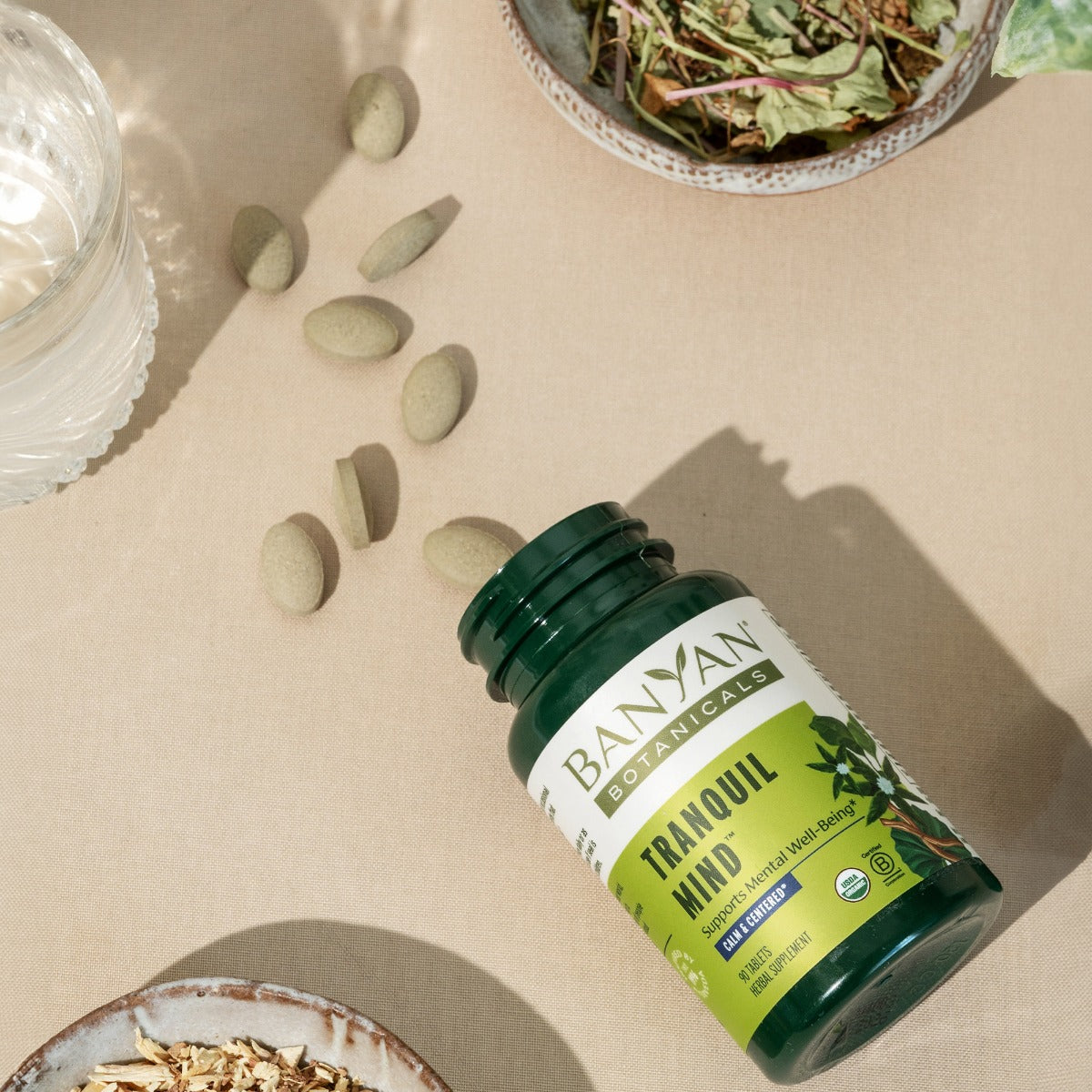 Tranquil Mind™ tablets coming out of bottle